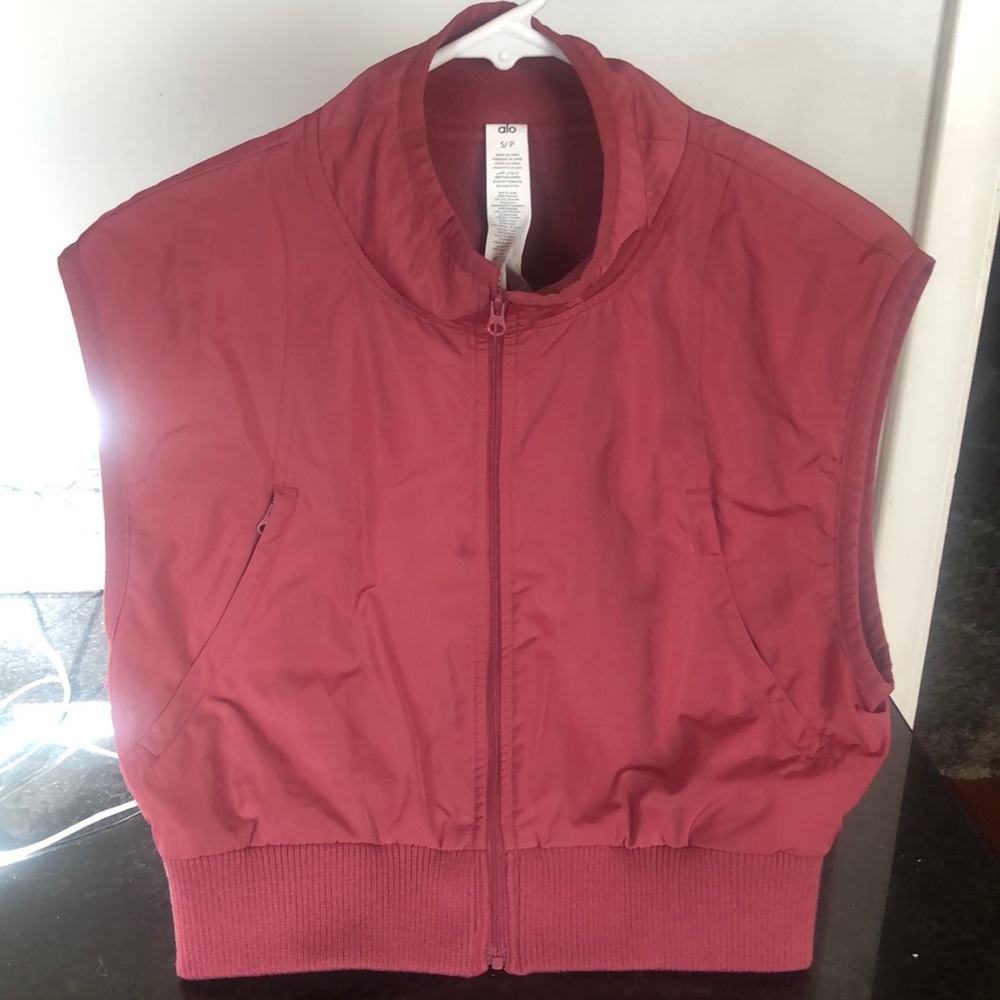 Alo fleece lined vest worn twice. Small stain by zipper but barely noticeable